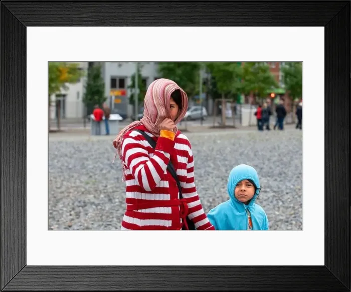 Framed Print : A poor Romanian gypsy mother with her young son in the center of Berlin Germany Framed Print : A poor Romanian gypsy mother with her young son in the center of Berlin Germany