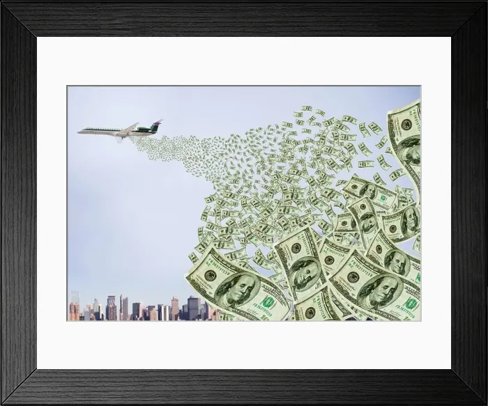 Framed Print : Airplane dropping money over city Framed Print : Airplane dropping money over city