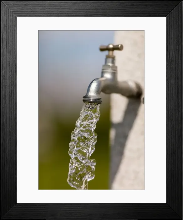 Framed Print : Water flowing from outdoors water tap on a sunny day Framed Print : Water flowing from outdoors water tap on a sunny day