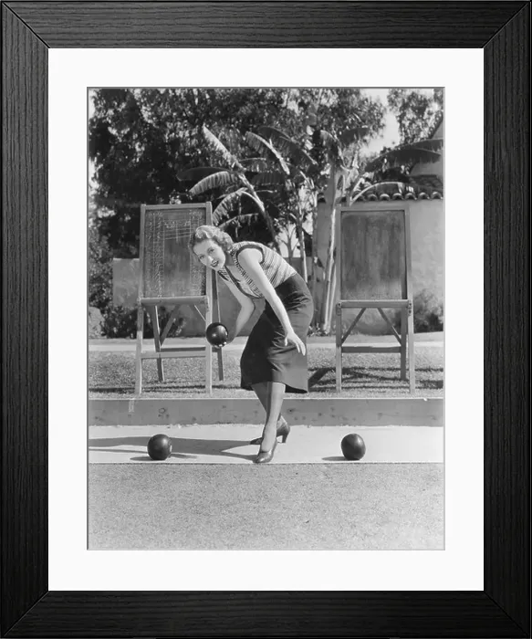Framed Print : Woman playing bocce outdoors Framed Print : Woman playing bocce outdoors