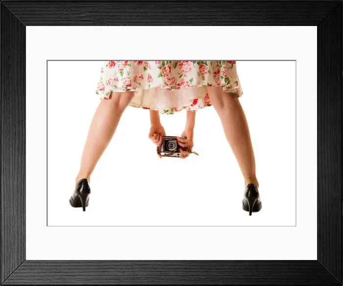 Framed Print : Woman's legs and hand, unusual back view of girl taking picture using vintage camera isolated on white background Framed Print : Woman's legs and hand, unusual back view of girl taking picture using vintage camera isolated on white background
