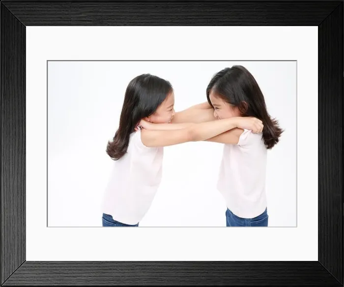 Framed Print : Twin girls fighting Framed Print : Twin girls fighting