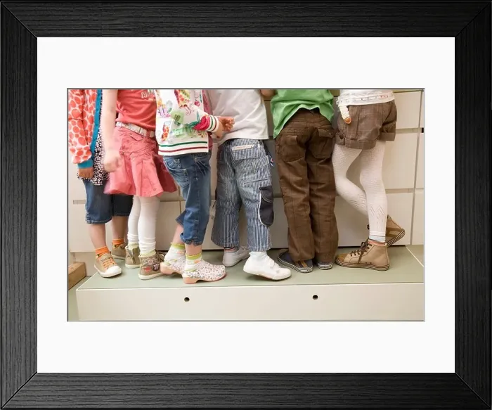Framed Print : Six pair of girls and boys legs Framed Print : Six pair of girls and boys legs