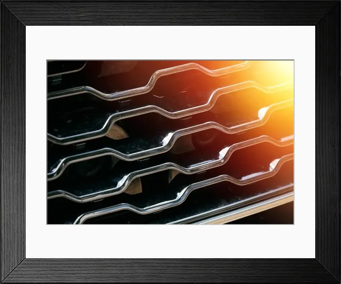 Framed Print : Grid of car with sunflare. Radiator grille. Metal close-up texture background. Chrome grill of big powerful engine macro Framed Print : Grid of car with sunflare. Radiator grille. Metal close-up texture background. Chrome grill of big powerful engine macro