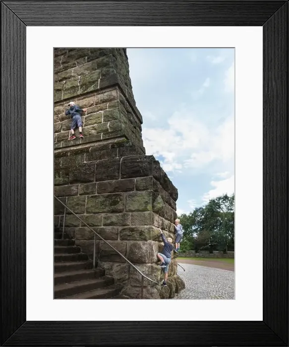 Framed Print : Boys climbing stone wall Framed Print : Boys climbing stone wall