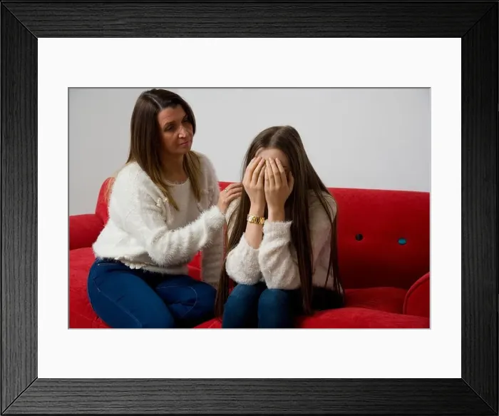 Framed Print : Mother comforting her sad teenage daughter Framed Print : Mother comforting her sad teenage daughter