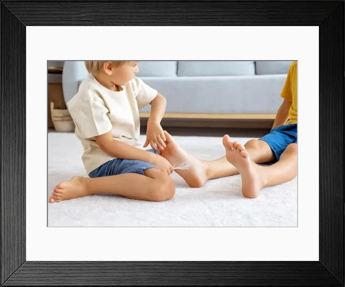 Framed Print : Happy positive children, tickling on the feet Framed Print : Happy positive children, tickling on the feet