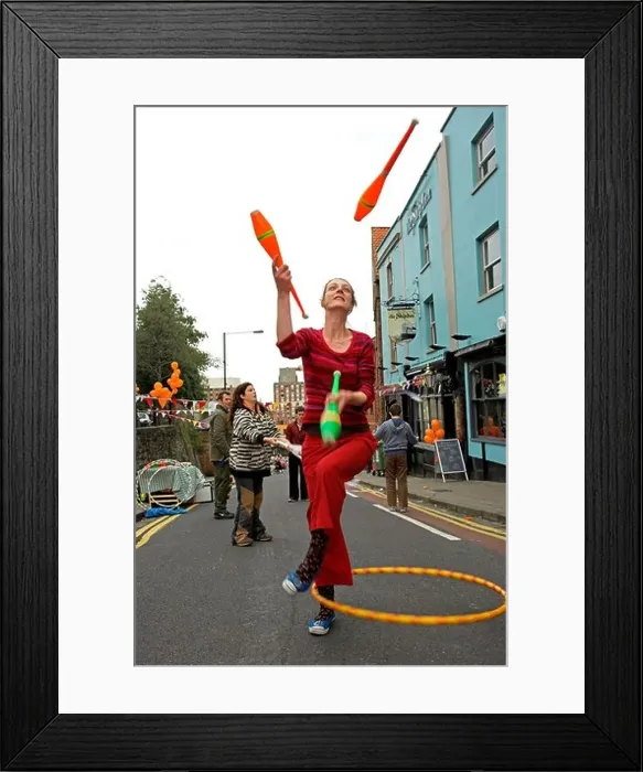 Framed Print : Woman juggler at street festival Bristol UK Framed Print : Woman juggler at street festival Bristol UK