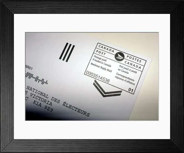 Framed Print : A Canada Post postage paid stamp on a letter photographed against a white background