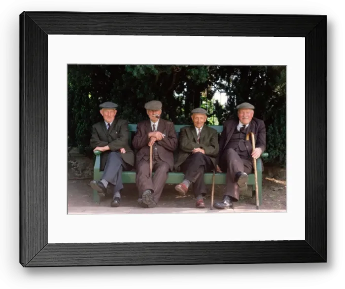 Framed Print : Four old men wearing cloth caps. Seated on park bench Framed Print : Four old men wearing cloth caps. Seated on park bench