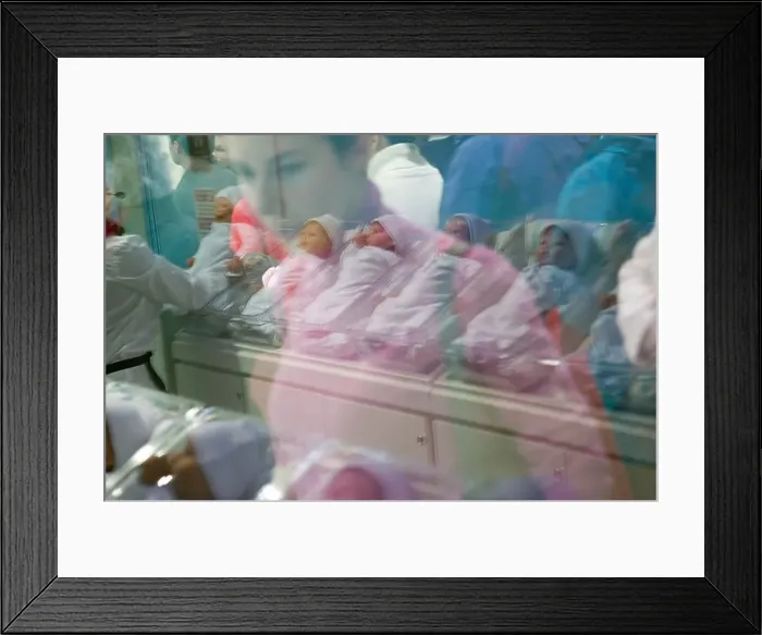 Framed Print : Newborn dolls stand on display at the maternity inside the FAO Schwarz toy store on 5th Avenue in New York City NY USA Framed Print : Newborn dolls stand on display at the maternity inside the FAO Schwarz toy store on 5th Avenue in New York City NY USA