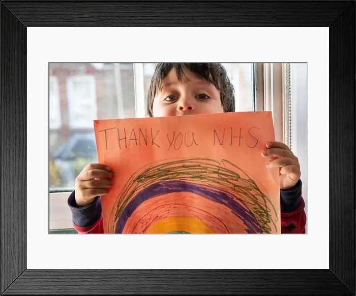 Framed Print : A boy holding up a drawing of a rainbow with the words Thank You NHS Framed Print : A boy holding up a drawing of a rainbow with the words Thank You NHS