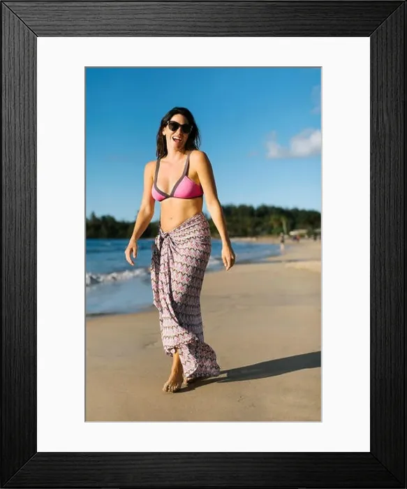 Framed Print : Woman in sarong at beach