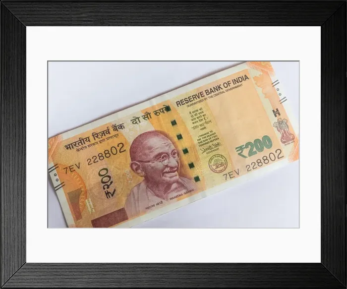 Framed Print : Indian currency 200 Rs note placed diagonally on a white background Framed Print : Indian currency 200 Rs note placed diagonally on a white background
