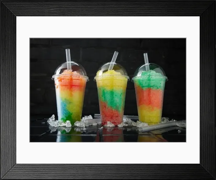 Framed Print : Assortment of various slush drinks in a row on black and dark background Framed Print : Assortment of various slush drinks in a row on black and dark background