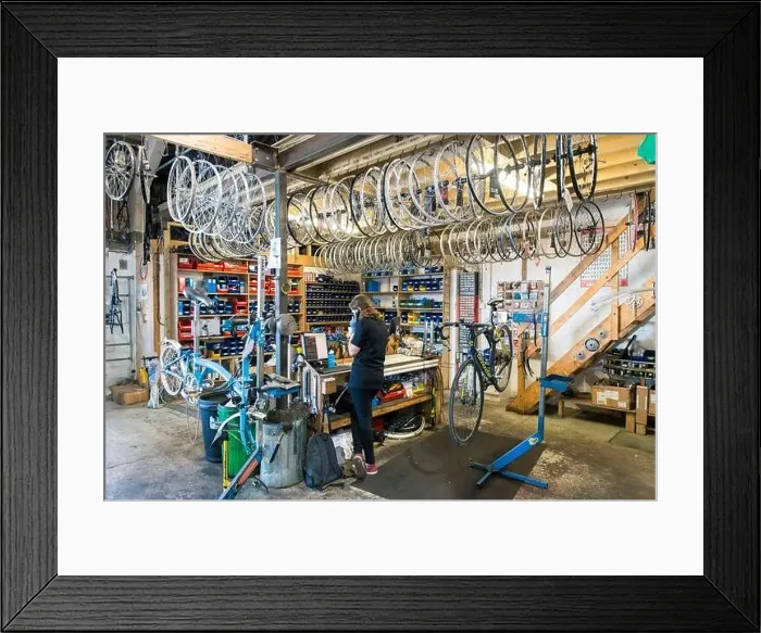 Framed Print : Lots of bike wheels and parts in stock for a cycle repair business hanging from the ceiling Framed Print : Lots of bike wheels and parts in stock for a cycle repair business hanging from the ceiling