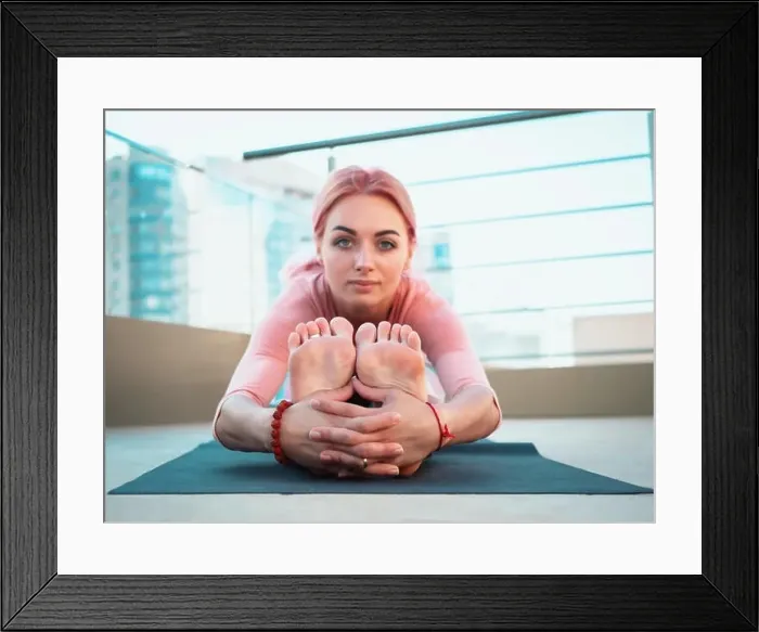 Framed Print : Young slim woman with pink dyed hair doing yoga practice on terrace of modern city Framed Print : Young slim woman with pink dyed hair doing yoga practice on terrace of modern city