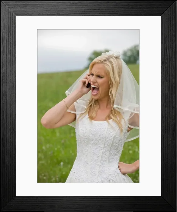 Framed Print : Bride shouting on the phone, hand on hip Framed Print : Bride shouting on the phone, hand on hip