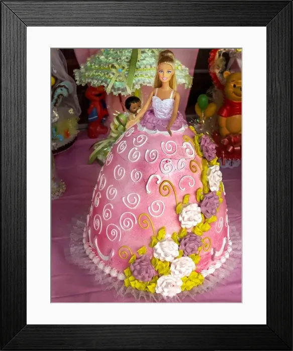 Framed Print : A cake in the shape of a Barbie Doll's dress is on display at a bakery in the Bronx, New York City Framed Print : A cake in the shape of a Barbie Doll's dress is on display at a bakery in the Bronx, New York City