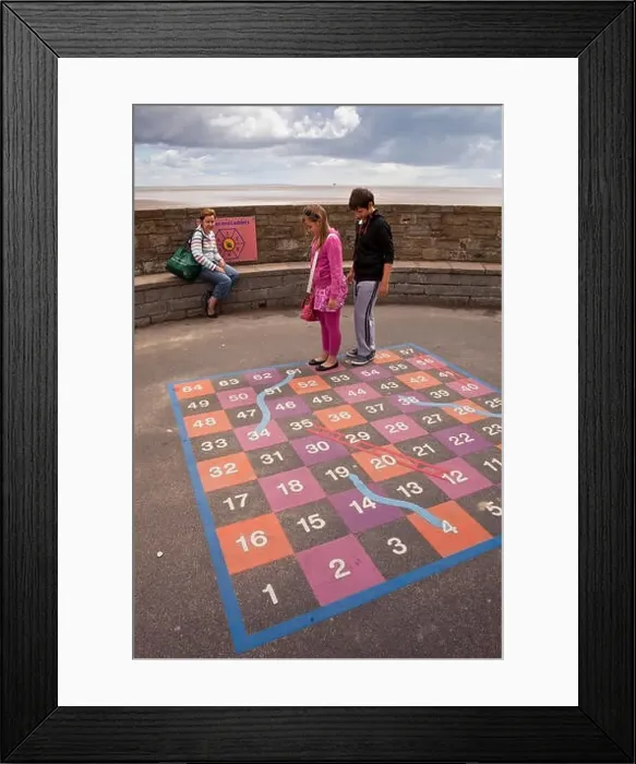Framed Print : UK, England, Lincolnshire, Cleethorpes, seafront, children with mother playing game of giant snakes and ladders Framed Print : UK, England, Lincolnshire, Cleethorpes, seafront, children with mother playing game of giant snakes and ladders