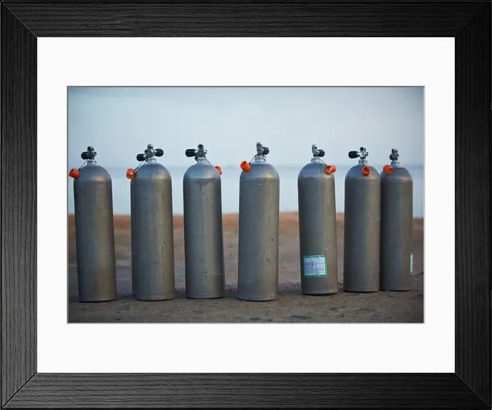 Framed Print : Collection of grey scuba diving air oxygen tanks waiting lined up Framed Print : Collection of grey scuba diving air oxygen tanks waiting lined up