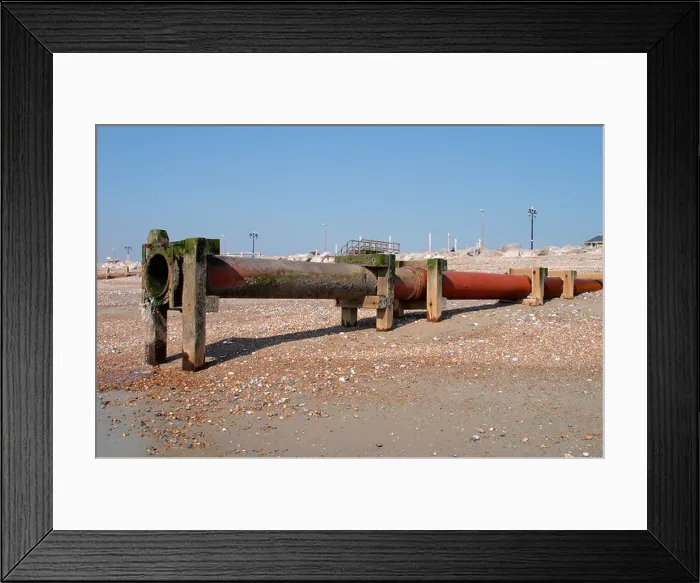 Framed Print : Sewage outlet pipe on beach at low tide in Worthing, West Sussex Framed Print : Sewage outlet pipe on beach at low tide in Worthing, West Sussex