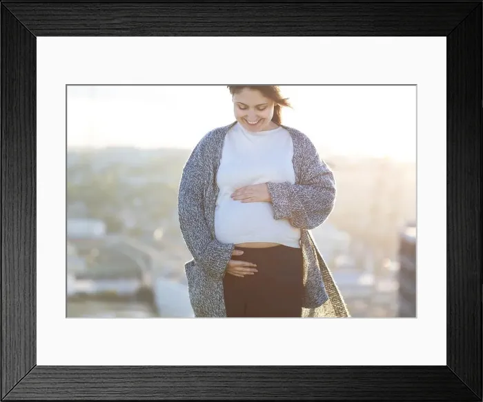 Framed Print : Young happy pregnant woman outdoor autumn day on city background Framed Print : Young happy pregnant woman outdoor autumn day on city background