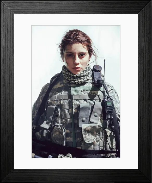 Framed Print : Portrait of army soldier standing against white background Framed Print : Portrait of army soldier standing against white background