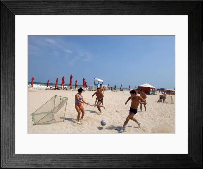 Framed Print : Young people playing football on a sandy beach, Vama Veche, Romania Framed Print : Young people playing football on a sandy beach, Vama Veche, Romania