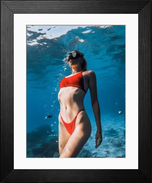 Framed Print : Close up view of sexy woman freediver in red bikini underwater in blue ocean Framed Print : Close up view of sexy woman freediver in red bikini underwater in blue ocean