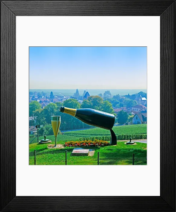 Framed Print : Hilltop giant bottle of Champagne pouring into huge glass Framed Print : Hilltop giant bottle of Champagne pouring into huge glass
