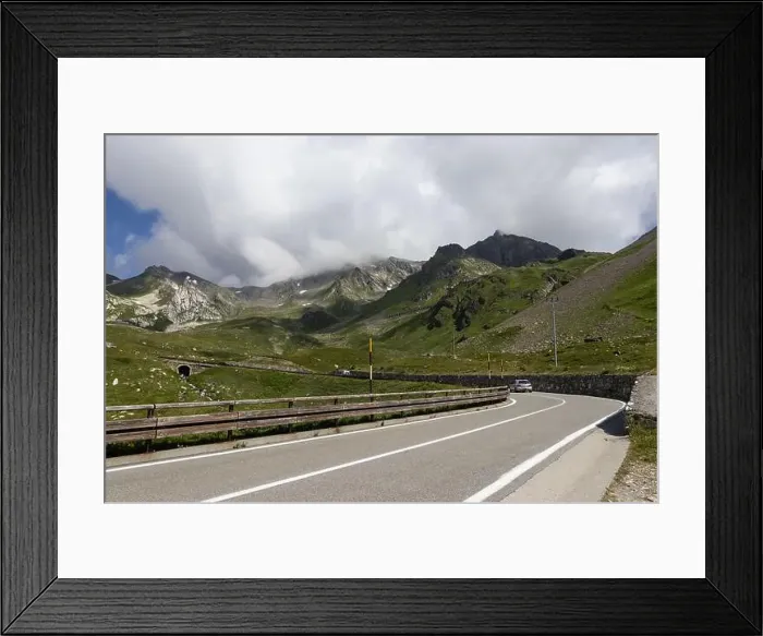 Framed Print : View of the road and surrounding mountain landscape at Colle del Gran San Bernardo in Saint-Rhémy-en-Bosses Framed Print : View of the road and surrounding mountain landscape at Colle del Gran San Bernardo in Saint-Rhémy-en-Bosses