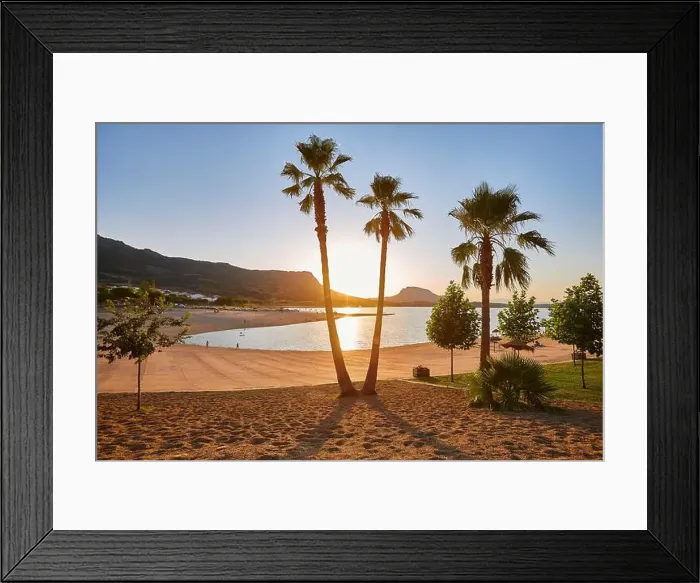 Framed Print : Sunset with palm trees at artificial beach. Peloche, Badajoz. Spain Framed Print : Sunset with palm trees at artificial beach. Peloche, Badajoz. Spain