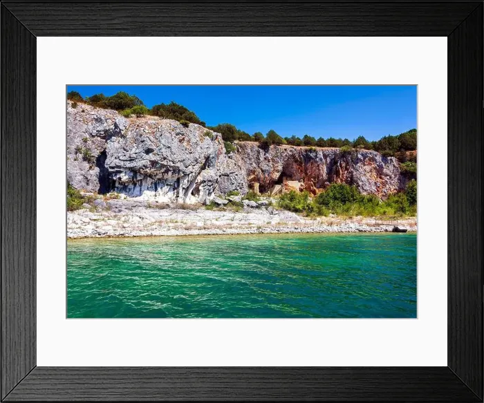 Framed Print : An ascetic building nestled into the rocky cliffs along the shore of Megali Prespa Lake Framed Print : An ascetic building nestled into the rocky cliffs along the shore of Megali Prespa Lake