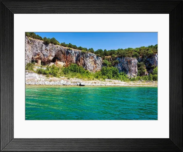 Framed Print : An ascetic building nestled into the rocky cliffs along the shore of Megali Prespa Lake