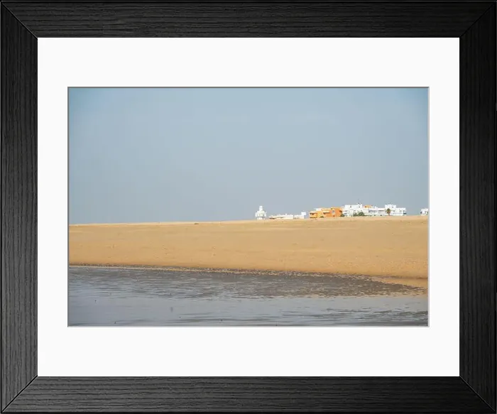 Framed Print : sand beach at Isla Cristina at the Costa de la Luz in Andalusia with view to town and lighthouse Framed Print : sand beach at Isla Cristina at the Costa de la Luz in Andalusia with view to town and lighthouse