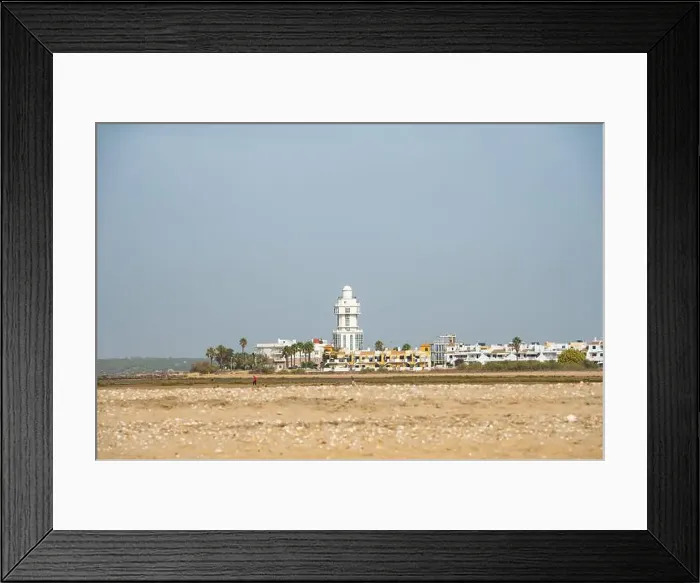 Framed Print : sand beach at Isla Cristina at the Costa de la Luz in Andalusia with view to town and lighthouse Framed Print : sand beach at Isla Cristina at the Costa de la Luz in Andalusia with view to town and lighthouse