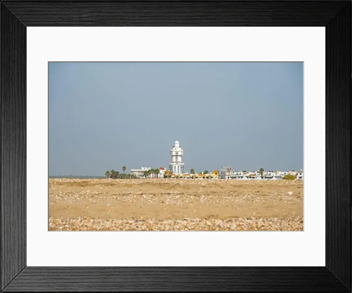 Framed Print : sand beach at Isla Cristina at the Costa de la Luz in Andalusia with view to town and lighthouse Framed Print : sand beach at Isla Cristina at the Costa de la Luz in Andalusia with view to town and lighthouse