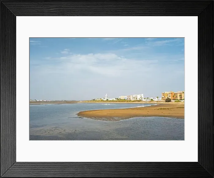 Framed Print : sand beach at Isla Cristina at the Costa de la Luz in Andalusia with view to town and lighthouse Framed Print : sand beach at Isla Cristina at the Costa de la Luz in Andalusia with view to town and lighthouse