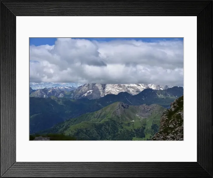 Framed Print : The Queen of the Dolomites, the Marmolada 3343 meters high, covered by clouds on a changeable summer day Framed Print : The Queen of the Dolomites, the Marmolada 3343 meters high, covered by clouds on a changeable summer day