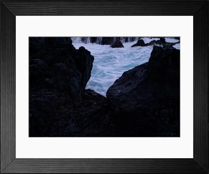 Framed Print : A glimpse of swirling ocean waters framed by dark volcanic rocks at Porto Moniz natural pools Framed Print : A glimpse of swirling ocean waters framed by dark volcanic rocks at Porto Moniz natural pools