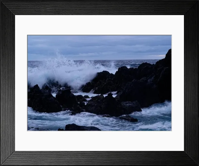 Framed Print : Powerful waves crash over dark volcanic rocks at Porto Moniz natural pools Framed Print : Powerful waves crash over dark volcanic rocks at Porto Moniz natural pools