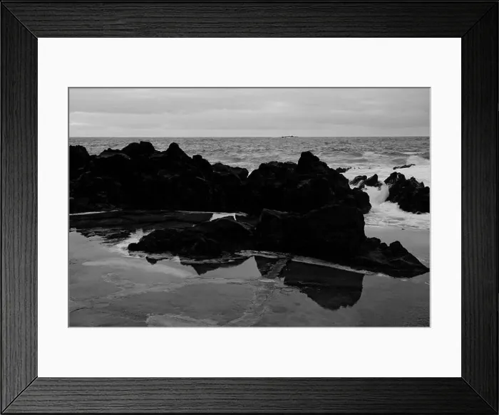 Framed Print : Black volcanic rocks reflect in shallow water against the backdrop of the Atlantic at Porto Moniz natural pools Framed Print : Black volcanic rocks reflect in shallow water against the backdrop of the Atlantic at Porto Moniz natural pools
