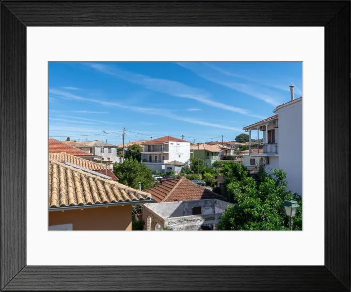 Framed Print : A general view of a Greek island village showing old and renovated buildings Framed Print : A general view of a Greek island village showing old and renovated buildings