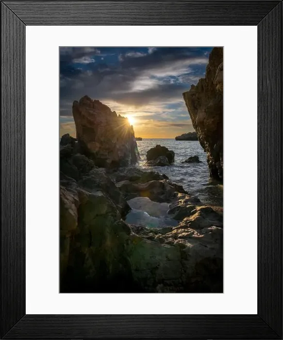 Framed Print : A seascape at sunset with sun rays and sky reflection on a rock pool. A nature, ecology, environment background Framed Print : A seascape at sunset with sun rays and sky reflection on a rock pool. A nature, ecology, environment background