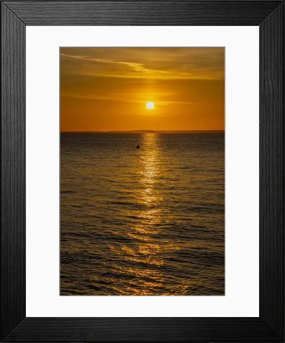 Framed Print : The sun setting over the Welsh coast sending a streak of Sunlight across the sea Framed Print : The sun setting over the Welsh coast sending a streak of Sunlight across the sea