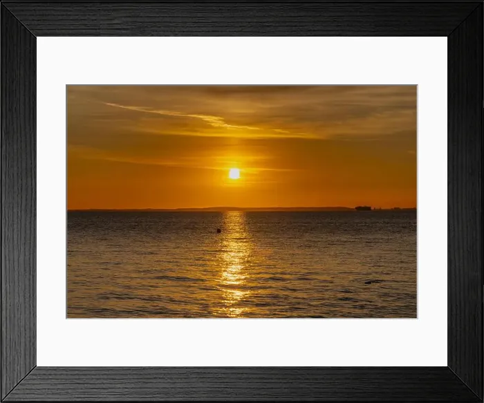 Framed Print : The sun setting over the Welsh coast sending a streak of Sunlight across the sea Framed Print : The sun setting over the Welsh coast sending a streak of Sunlight across the sea