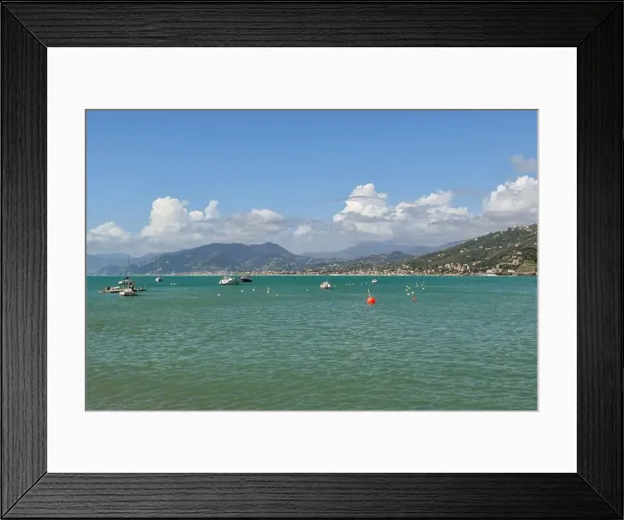 Framed Print : View of the Bay of Fairy Tales in the Italian Riviera with anchored boats and the coast in the background Framed Print : View of the Bay of Fairy Tales in the Italian Riviera with anchored boats and the coast in the background