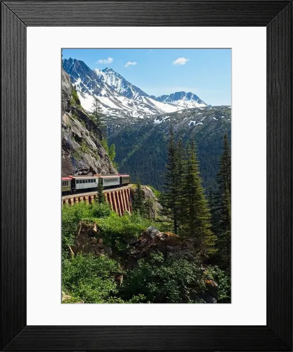 Framed Print : A scenic passenger train rounding a curve high in the mountains above Skagway, Alaska Framed Print : A scenic passenger train rounding a curve high in the mountains above Skagway, Alaska
