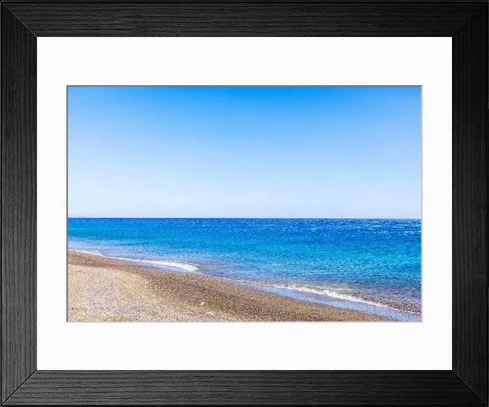 Framed Print : Calm Mediterranean Sea with pebble beach on Crete island, Greece, under clear blue sky Framed Print : Calm Mediterranean Sea with pebble beach on Crete island, Greece, under clear blue sky